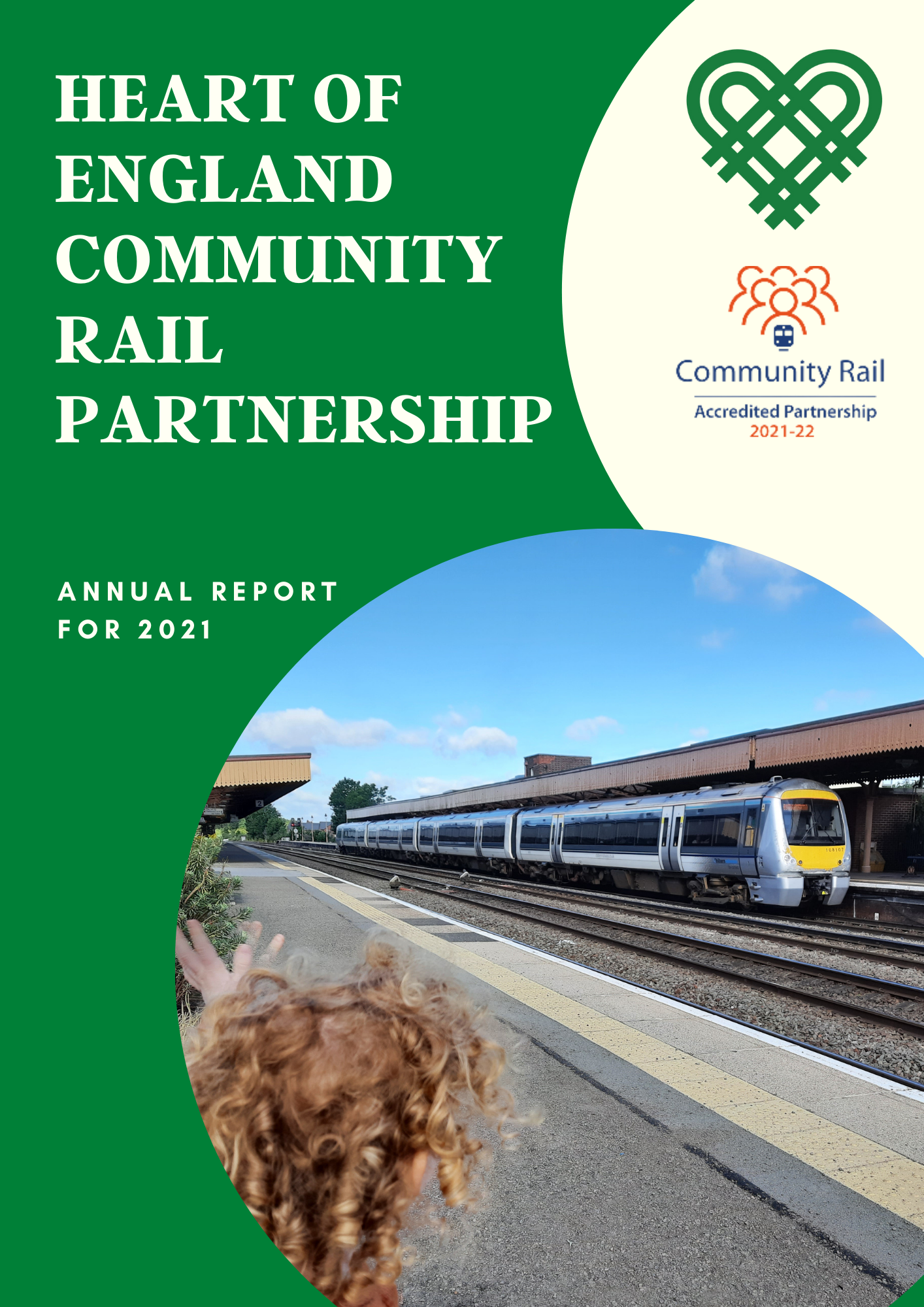 Front cover for Heart of England CRP 2021 Annual Report. Photo of a child waving to a train at Leamington Spa Station.