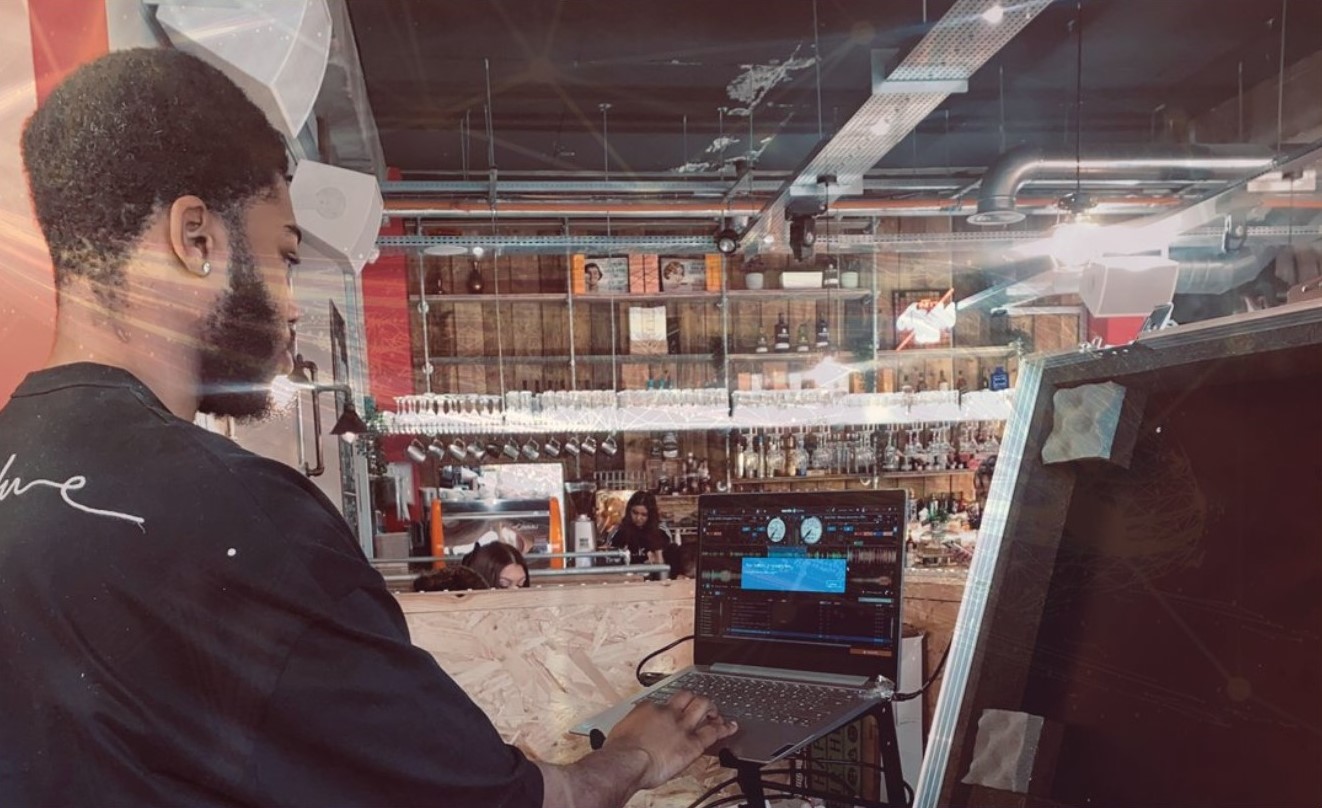 Young man at a DJ deck