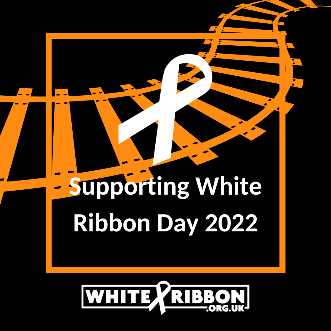 Orange train tracks on a black background.  White ribbon with the words 'Supporting White Ribbon Day 2022'